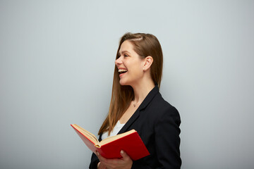 Laughing woman teacher holding book. Isolated portrait with copy space.