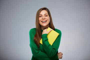 Happy woman teacher or student with yellow book. Isolated female portrait. - 553319796