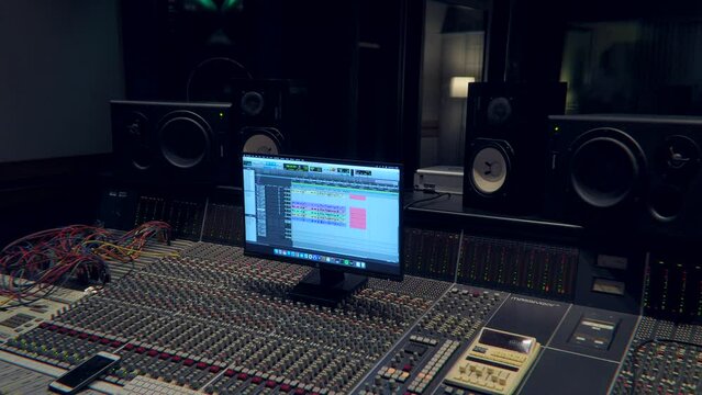 Studio sound. Analog mixing console. Cable switching. Sound engineer. Sequencer. Acoustic system. Massivars Recording Studio in Italy Milano 12.2022