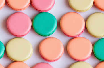 a lot of macaron with pastel color on white background