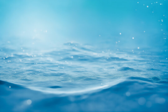 Bright water surface with bokeh and glitter effects.