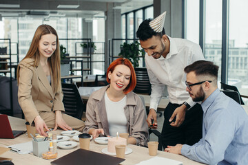 Colleagues celebrating a birthday in the office