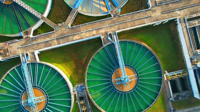 Drones are flying over water treatment plants, wastewater treatment ponds to remove chemicals and contaminants. tap water industry for consumption. pure drinking water concept. 4K
