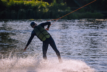 Athlete on water skis. Water sports. Summer, river.