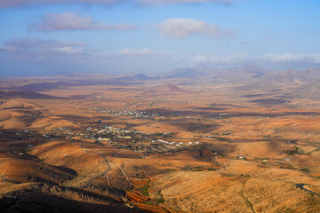 Fototapeta na wymiar Panoramic view over the village of Valle de Santa Inés in Fuerteventura island from the Mirador of Morro Velosa in the Rural park of Betancuria, Canary Islands, Spain