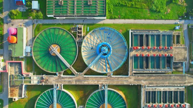 Drones are flying over water treatment plants, wastewater treatment ponds to remove chemicals and contaminants. tap water industry for consumption. pure drinking water concept. 4K
