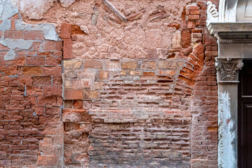 A beautiful vintage brick wall, showing different layers of previous constructions.