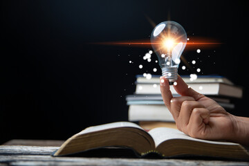Light bulbs and books. Concept of reading books, knowledge, and searching for new ideas. Innovation...