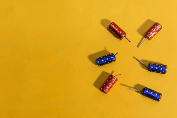 Indian festival Diwali firecrackers bomb on yellow background. Diwali items