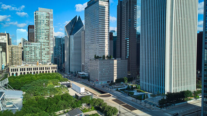 Looking over Millennium Park in downtown Chicago lined with skyscrapers