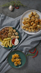 Assorted asian food on black background. Asian cuisine. Top view with copy space