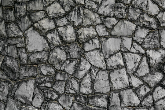 Texture of grey stone wall as background © New Africa