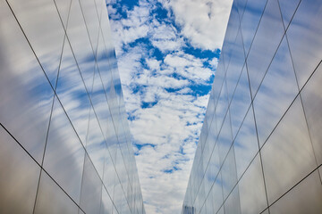 Fototapeta na wymiar Steel straight walls at 9 11 memorial in New Jersey looking up at sky