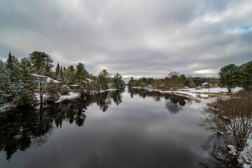 Reflection houses on lake winter day  cold and beautiful 