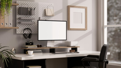 Side view of a modern bright office working space with computer mockup and decor on table