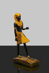 statue made of basalt stone, glass and metal dating back to the Pharaonic era