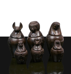statue made of basalt stone, glass and metal dating back to the Pharaonic era
