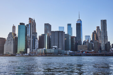 Fototapeta na wymiar New York City skyline along water viewed from Brooklyn