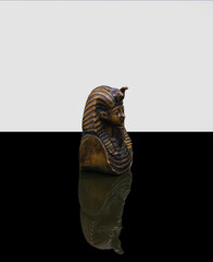 statue made of basalt stone, glass and metal dating back to the Pharaonic era