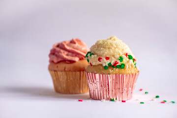 Two pieces of sweet cupcakes in white background.