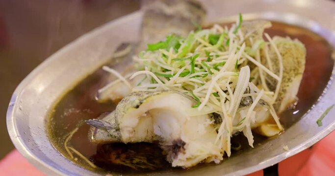 Steamed fish with green onion and ginger