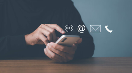 Man use smartphone contact us or e-mail marketing concept, Customer support hotline Contact us...