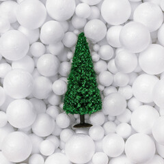 Creative Abstract composition made of Christmas tree in white snow balls decoration. .Minimal concept of New Year's and Christmas Holidays. Flat lay.