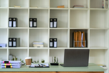 Business finance office concept on table with laptop computer and graph document calculator