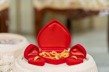 Dowry (gold necklace) on a flower tray at a wedding Dowry is placed on a beautiful flower tray at a wedding in Thailand