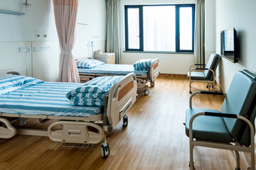 Empty bed in hospital ward