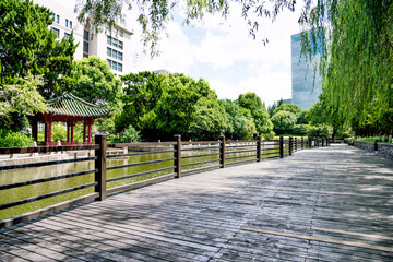 City park outdoor scenic with pond and fence in China
