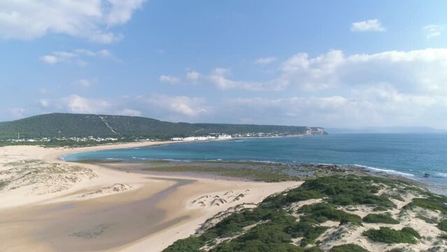 Aerial establishing view of the iconic coastline of Los Canos de Meca in Spain