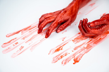 Obraz na płótnie Canvas Female hands in blood on a white background. 