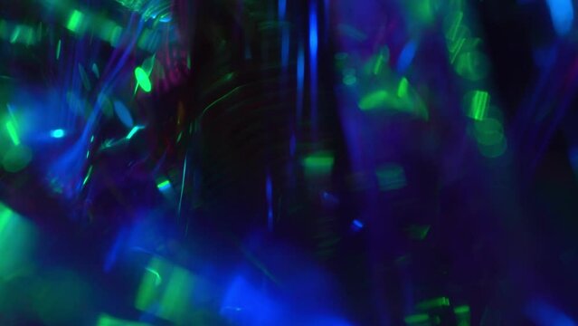 Viva magenta purple neon blue green pink flash sparkle. Light through crystal. Magical multicolor holographic background. Shiny festive space