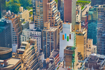 Looking down on tops of New York City skyscrapers in morning light