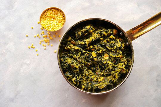 Palak and Moong dal sabzi. also known as spinach and lentil curry. Healthy green leafy vegetables Saag. Copy space. 