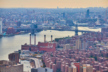Fototapeta premium High over Manhattan apartments overlooking New York City industrial area and bridge