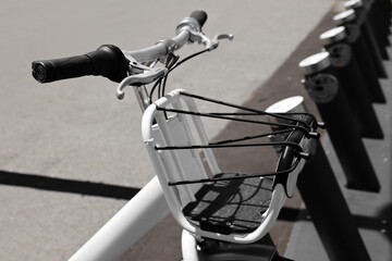 Fototapeta na wymiar Modern bicycle parked on city street, closeup