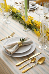 Festive table setting with floral decor