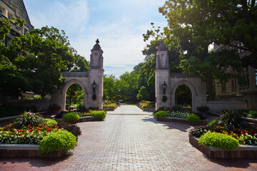 Welcome to Indiana University in Bloomington with brick boardwalk through Sample Gates © Nicholas J. Klein