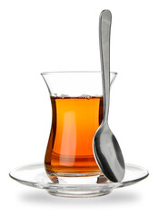 Glass of Turkish tea with spoon on white background