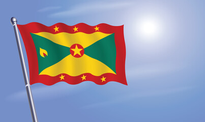 Grenada flag against a blue sky