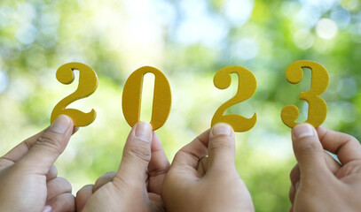 Numbers2023Wood Tax word on business background and tax concept 2023 tax payment, new 2022 tax...