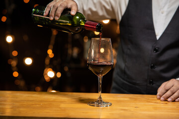 Barman pouring whiskey whiskey glass beautiful night