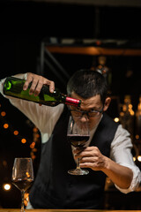 Barman pouring whiskey whiskey glass 