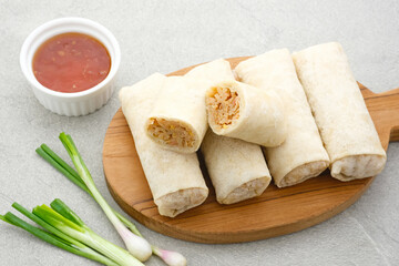 Lumpia or lunpia, traditional snacks from Semarang, Central Java, Indonesia. Traditional spring rolls contain stir-fried bamboo shoots (rebung), eggs, and chicken or shrimp. 
