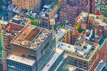 Looking down on tops of skyscrapers in New York City with air fans