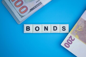 euro and dollar money with the word bonds. Bonds increasing concept.