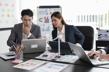 Asian business working together to discuss new projects.