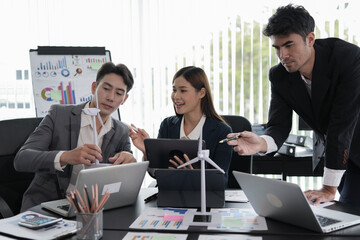 Group of asian business people working, discussing new projects together, having fun at the office.